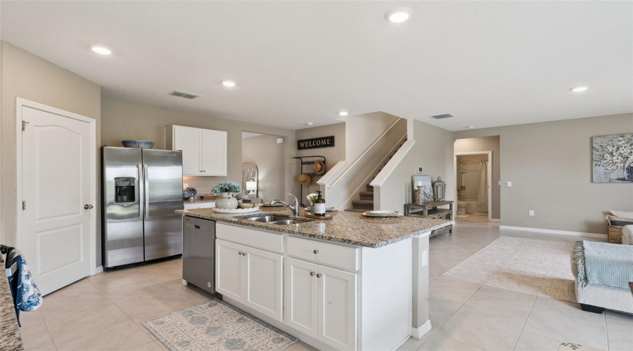 View of kitchen, family room and foyer from the dining are