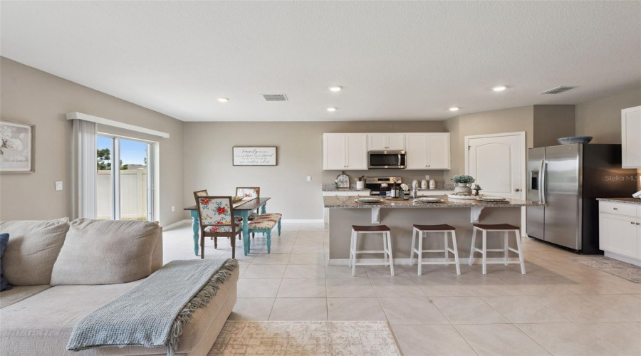 View of the dining area and kitchen from the family room