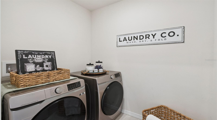 The laundry room can be found upstairs between the owners bedroom and 3rd bedroom