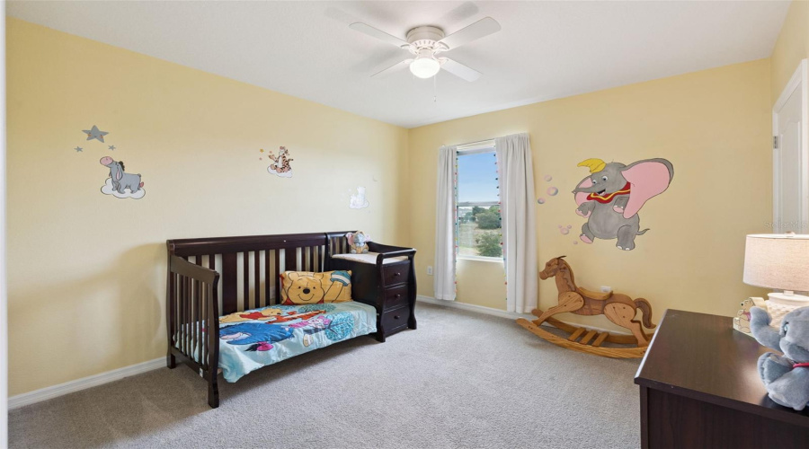 Bedroom 3 overlooks the backyard and is found right off the loft and laundry room