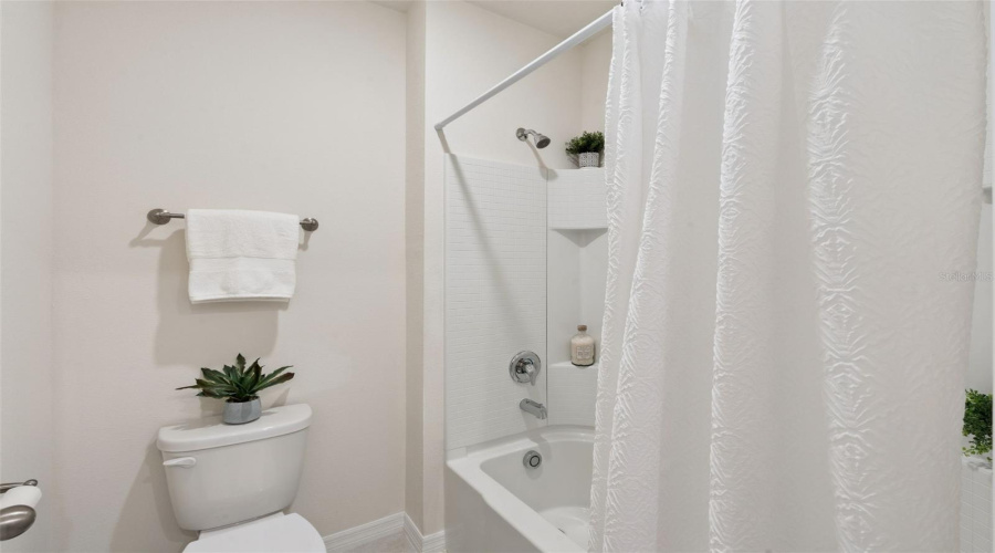 Bathroom three also offers a tub shower combination