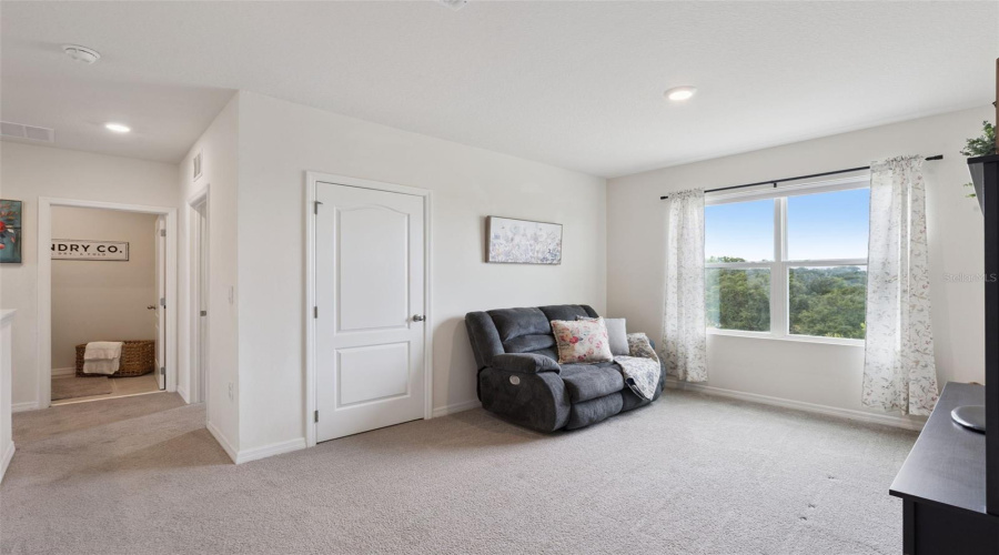 View of the loft and laundry room coming from the 4th and 5th bedroom area