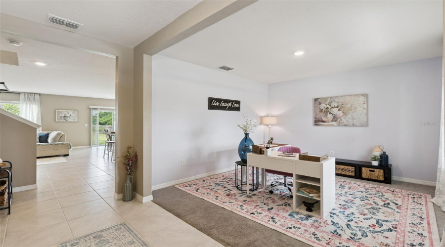 As you enter the front door you're greeted by a flex space to the right currently showcased as an office