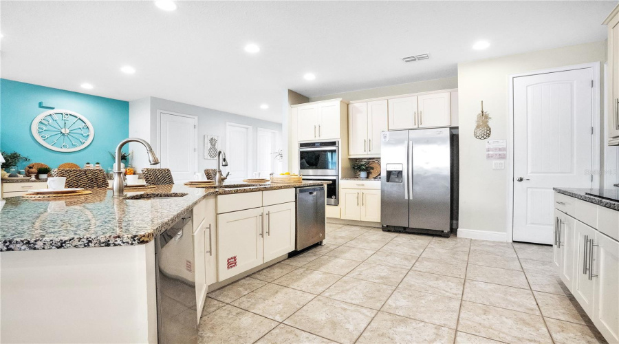Fully equipped gourmet kitchen offering generous prep space, extensive storage, walk-in pantry, and functionality built for luxury vacation living