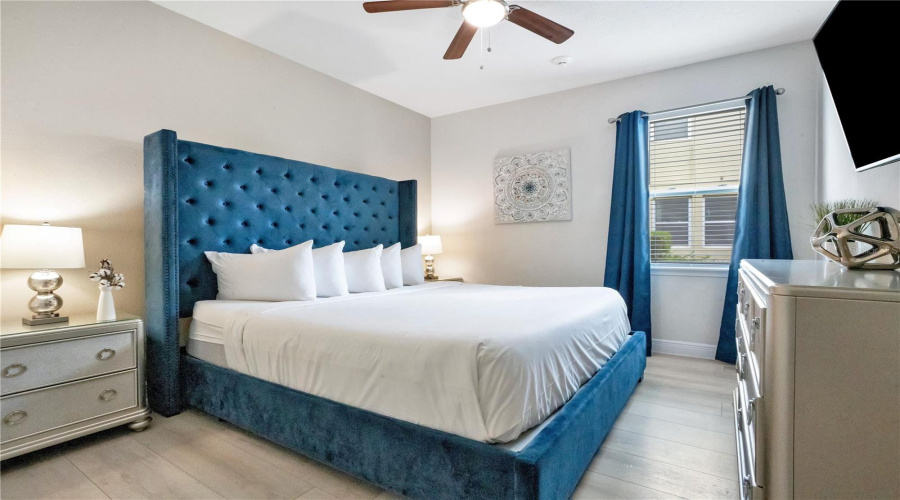 Spacious downstairs ensuite bedroom (3) with designer furnishings and luxury vinyl plank flooring