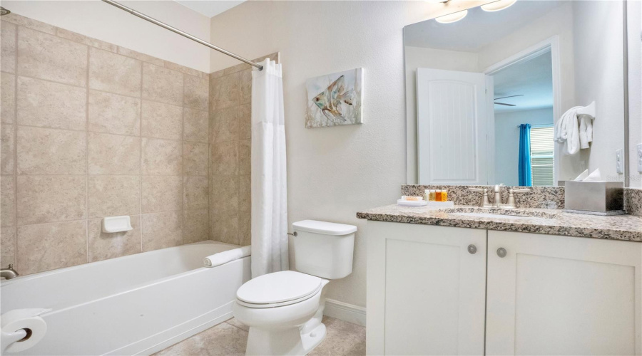 Ensuite to Bedroom #4 -Well-appointed with granite counters and tiled shower surround