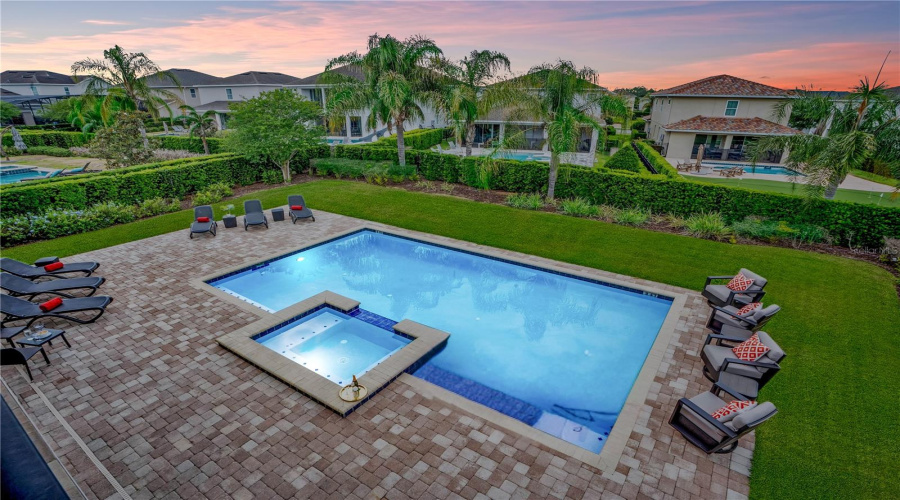 Resort-style private pool and spa with expansive paver deck, and one of the largest lots in all of ENCORE!