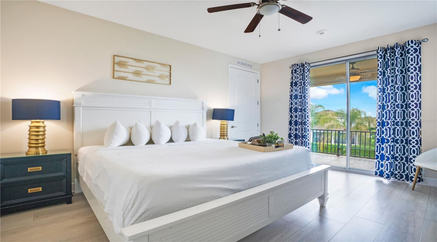 Elegant upstairs primary suite (#8) opening directly to the oversized screened balcony