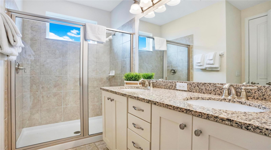 Spacious ensuite bathroom (#8) with granite counters and large walk-in shower