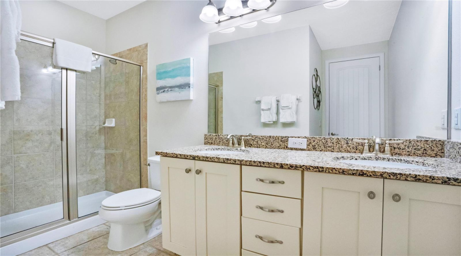 Private ensuite bath (#9) with clean modern finishes and generous vanity space