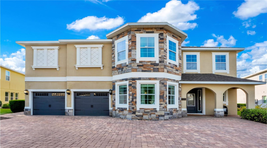Welcome to 7734 Graben Street - a rare 11-bedroom luxury vacation estate in Encore at Reunion with exceptional short-term rental income potential near Disney.