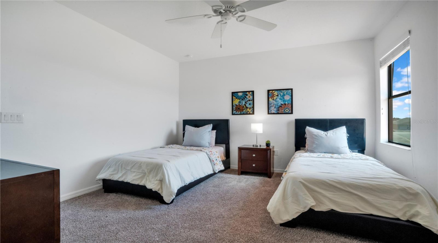 Twin bedroom maximizing guest capacity for rental potential.