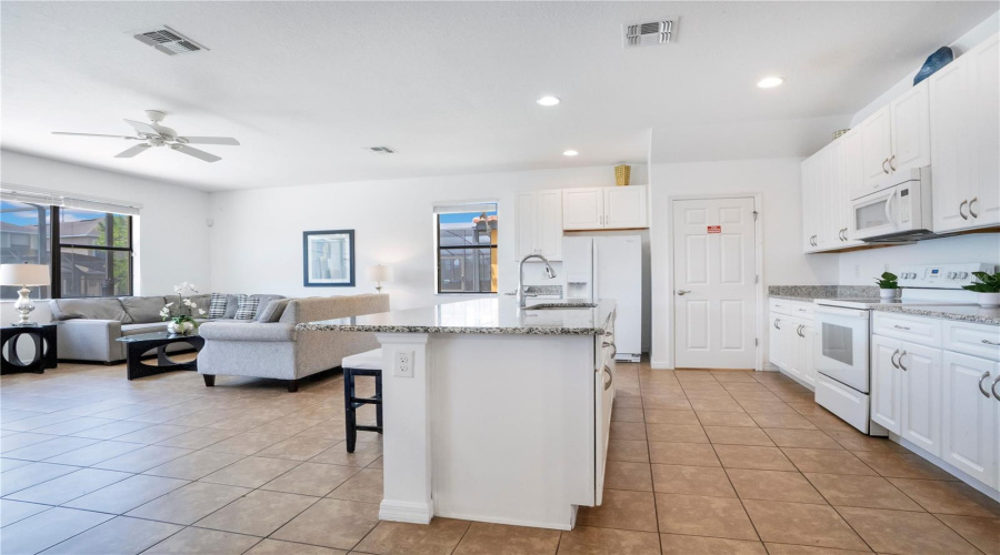 Kitchen and living area with seamless open floor plan.