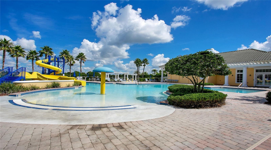 Resort style splash pad and pool area for residents and guests.
