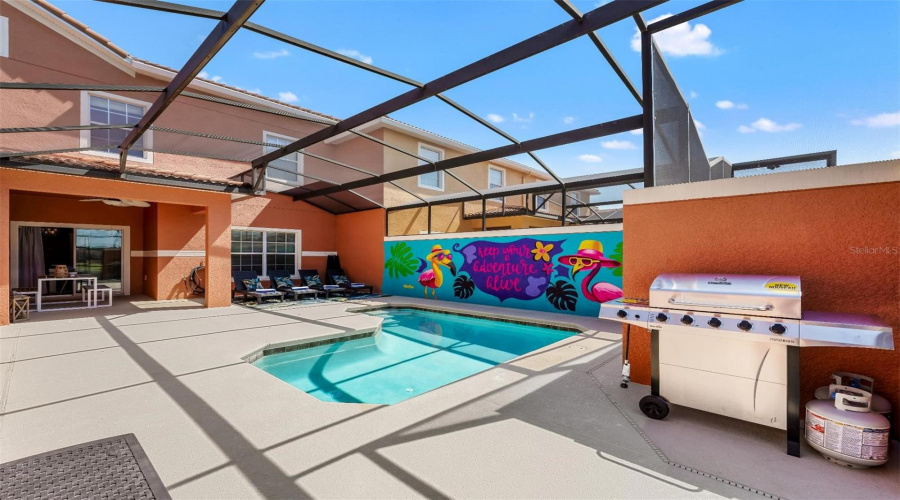 Covered lanai, screened pool, and room to grill!