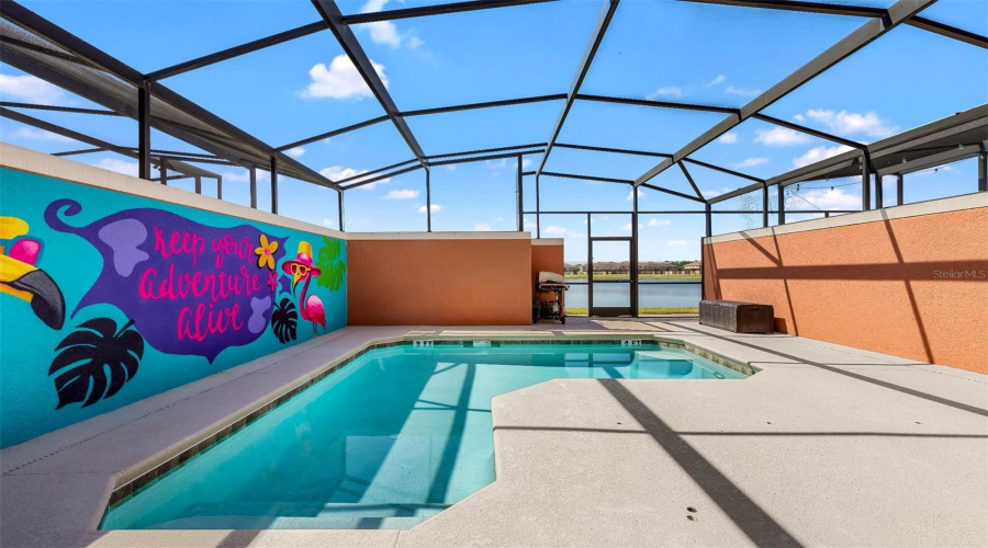 Private covered lanai overlooking a screened pool, complete with water views!