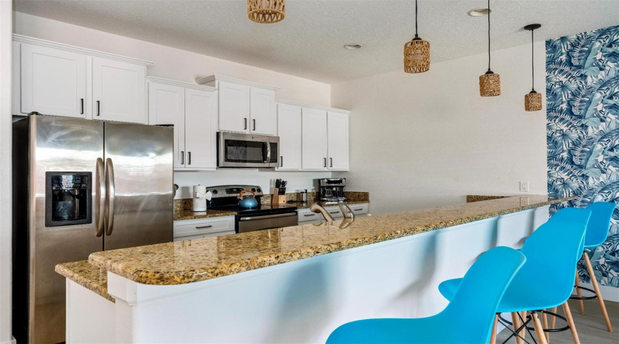 The fresh and modern interior delivers an OPEN CONCEPT layout designed for both every day living and entertaining, featuring durable LUXURY VINYL PLANK & TILE FLOORING throughout, a bright and inviting living and dining area, and a well appointed kitchen overlooking it all with easy access to the outdoor living space.