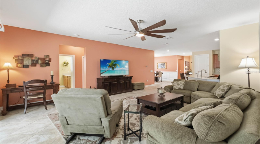 open concept family room to kitchen and dining areas