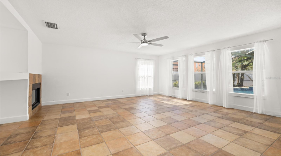 Rear family room with fire place and new fan