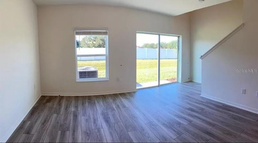 “Living area featuring an open concept and abundant natural light.”
