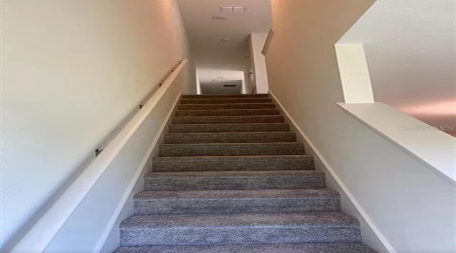 “Staircase leading to the second floor.”