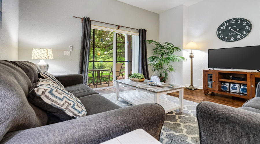 Contemporary living area  with sliding doors leading to one of two personal patio areas