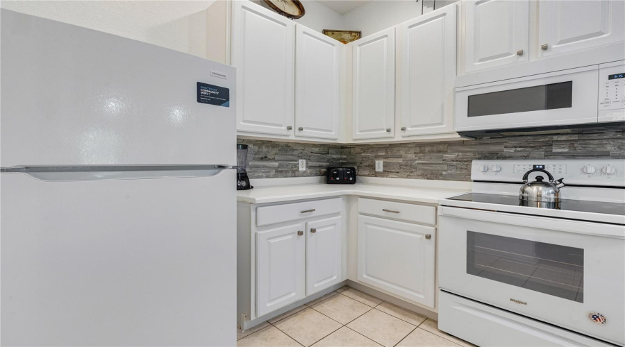 Well designed kitchen sits alongside the dining area and living room
