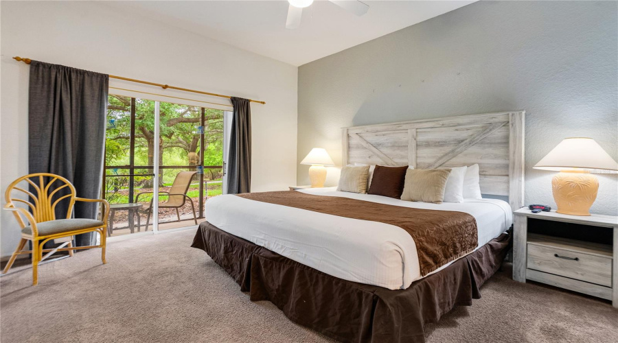 Spacious bedroom with sliding patio doors leading to your own private screened in patio.