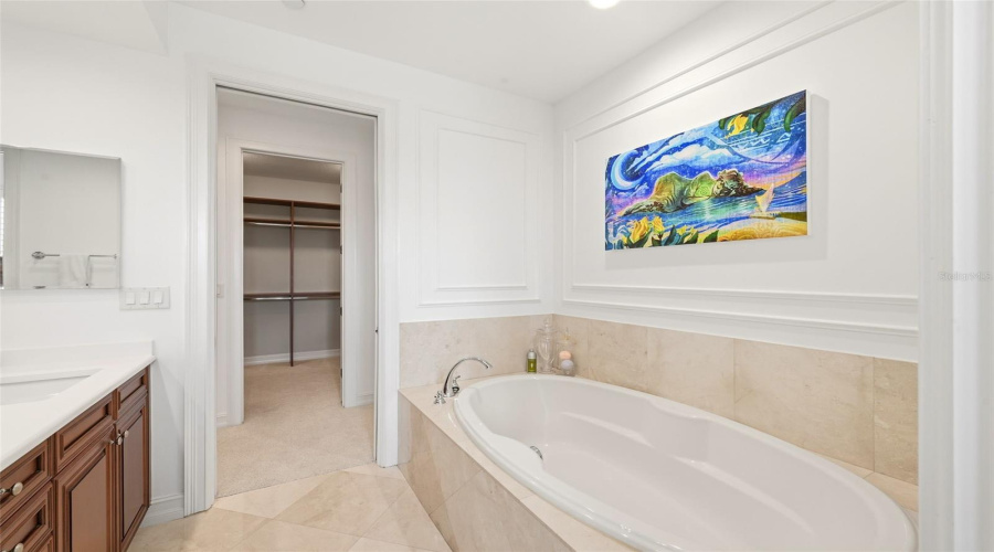 Primary Bath With Marble Floors and Bath tiles