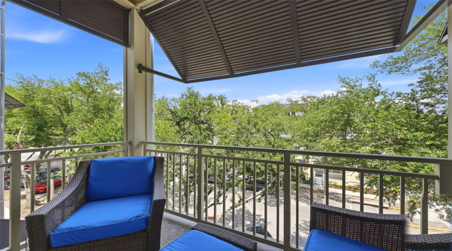 Balcony off Living Room with ceiling fan and coach light