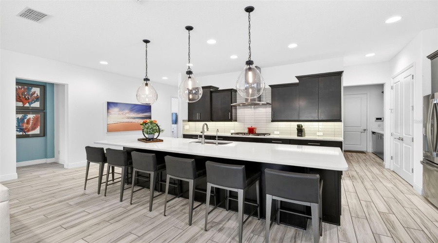 Kitchen with lots of cabinets and island seating