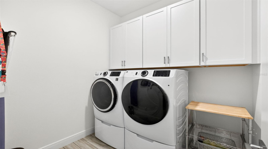 Interior laundry room with extra cabinet space