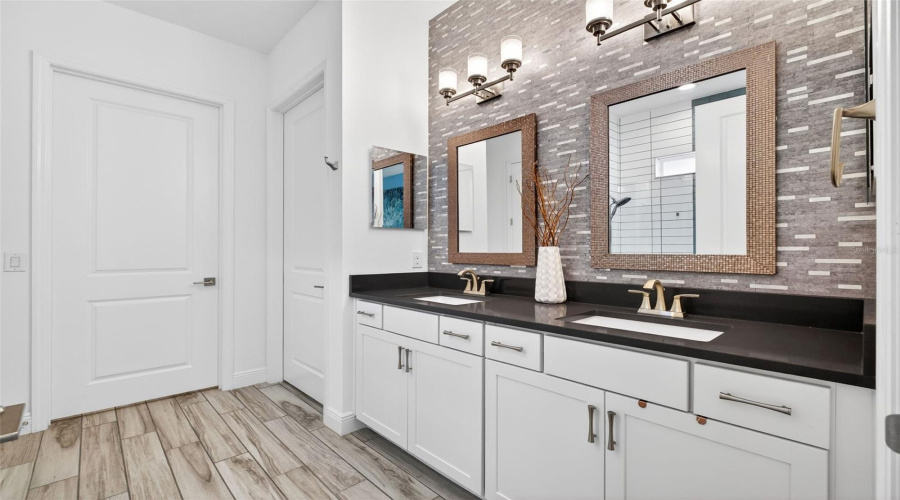 Primary bathroom suite with double vanity