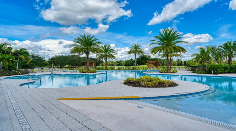 Resort-style pool with beach entrance