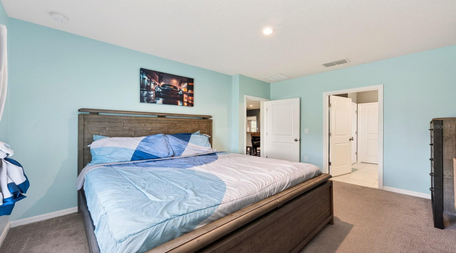 A desirable SPLIT-BEDROOM FLOOR PLAN provides added privacy, with the Primary Suite tucked away at one end of the home.