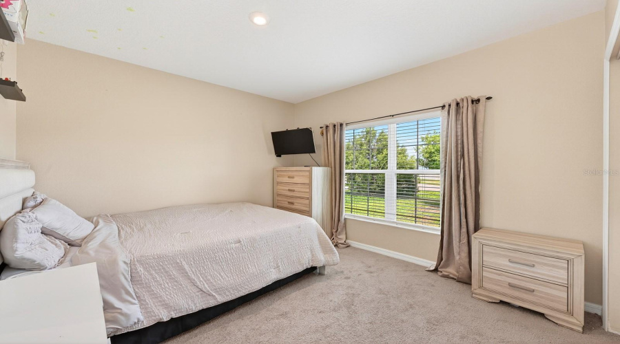 Two additional bedrooms and SECOND FULL BATH are located on the opposite side of the home, offering flexibility for guests, family, or a home office. Bedroom 2