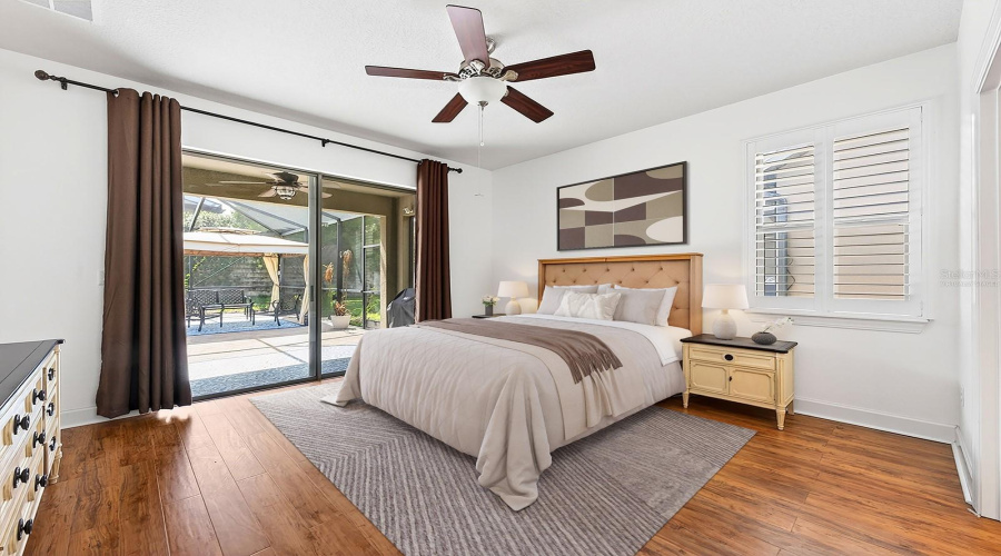 All bedrooms feature ATTRACTIVE LAMINATE FLOORING, including the GENEROUS PRIMARY SUITE, where sliding glass doors fill the room with natural light and provide direct access to the lanai. Virtually Staged
