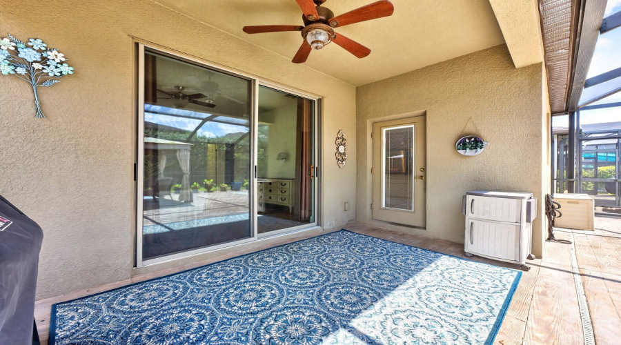 The covered and screened patio opens to an OVERSIZED SCREENED LANAI that spans most of the backyard, creating the perfect private retreat for morning coffee, outdoor dining, or evening gatherings.