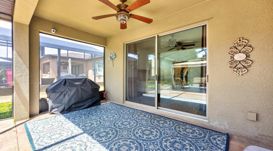 The covered and screened patio opens to an OVERSIZED SCREENED LANAI that spans most of the backyard, creating the perfect private retreat for morning coffee, outdoor dining, or evening gatherings.