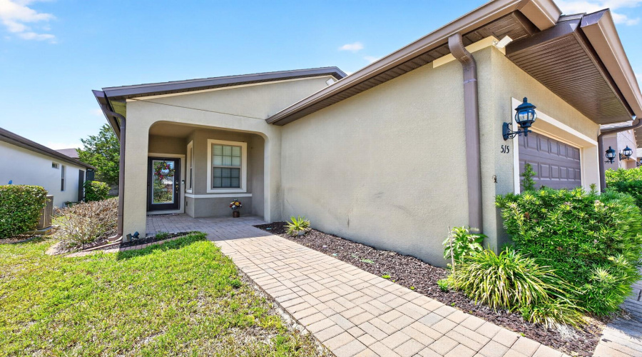 From the moment you arrive, the home impresses with its BRICK PAVER DRIVEWAY AND WALKWAY leading to a stunning ETCHED GLASS FRONT DOOR, creating beautiful curb appeal and a warm welcome.