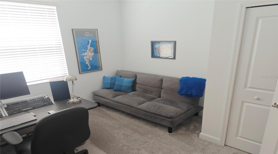 4th bedroom with sitting area and closet