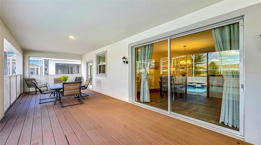 Covered Lanai With Upgraded Wood Flooring.
