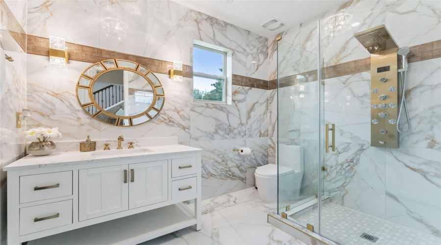 Guest bathroom was completely updated and turned into a full bath with a shower.