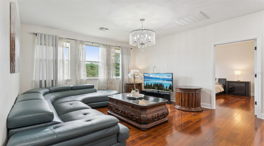 An expansive loft area perfect for a media room, playroom, study space, or additional living area.
