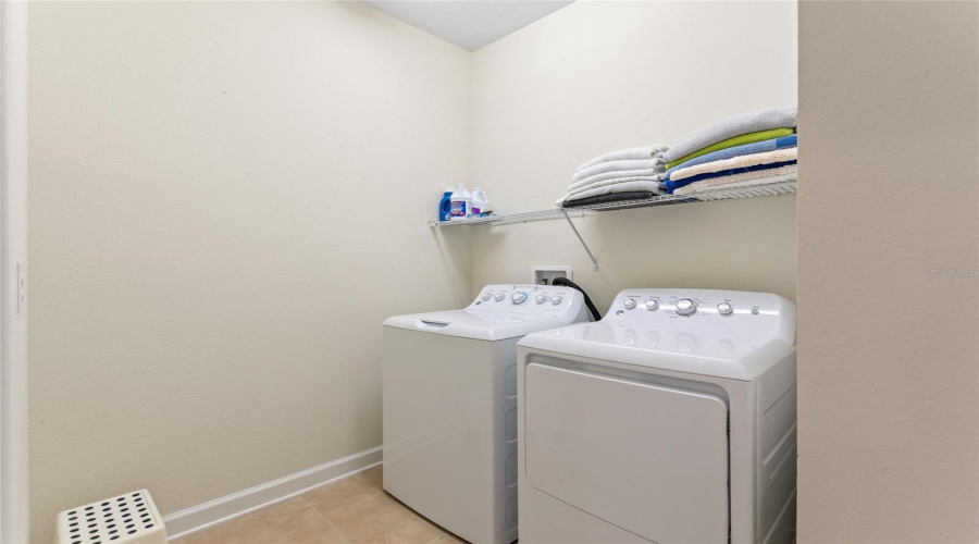 Landry Room Connects to Primary Bedroom for Added Convenience