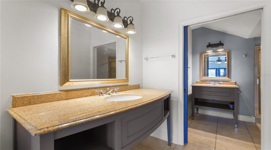 Vanity area separate from main bath. Walk in closet on other side.