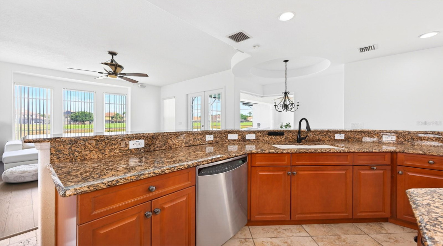 The extended breakfast bar provides extra prep space and room for counter-height seating.