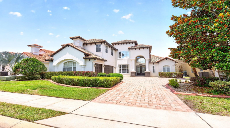 Experience LUXURY LIVING in this stunning 5-bedroom, 4-bath estate home in the highly sought-after Greens at Providence, an impressive 24-HOUR GUARD-GATED golf community in Davenport.