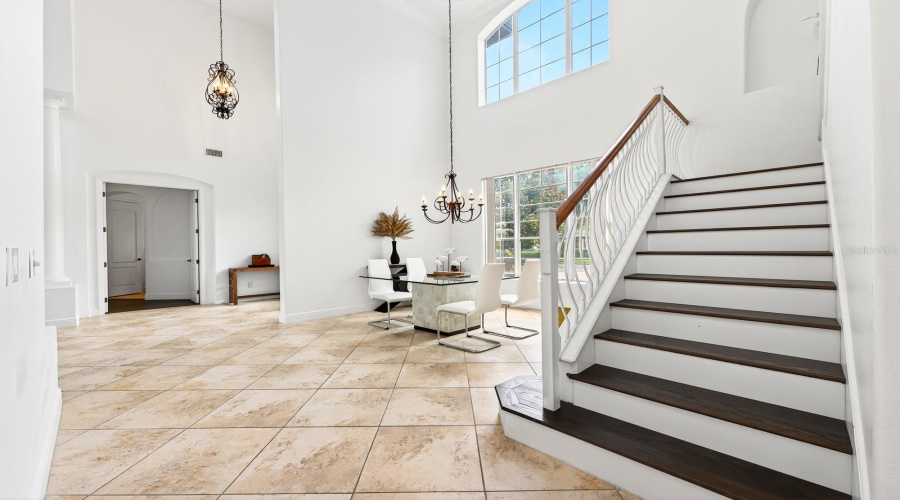 Ascend the STUNNING STAIRCASE to discover a Bonus Room and two additional bedrooms, both with NEW ENGINEERED HARDWOOD FLOORING and walk-in closets.