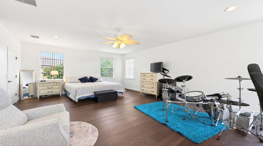 A SECOND PRIMARY SUITE with its own PRIVATE EN SUITE BATH, makes it ideal for guests or multi-generational living. Bedroom 4